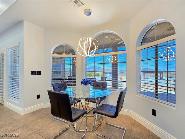 3780 Shawnee Ave, Pahrump, NV 89048 - dining space featuring tile patterned flooring and a chandelier