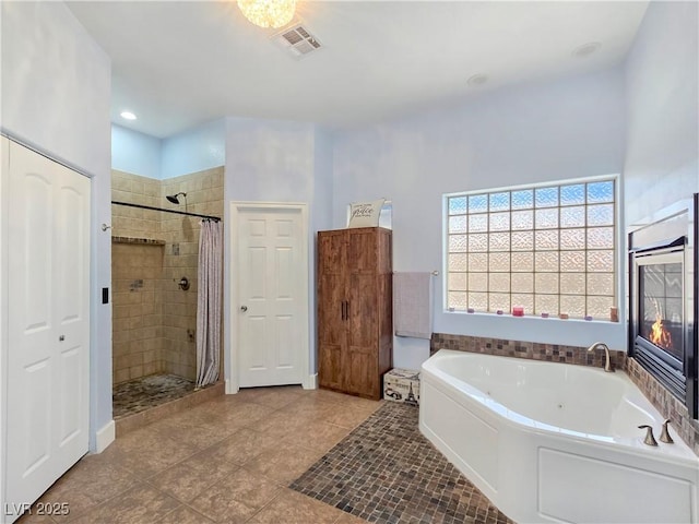3780 Shawnee Ave, Pahrump, NV 89048 - full bath featuring a jetted tub, a shower stall, and tile patterned floors