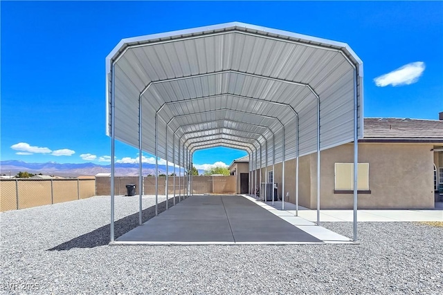 3780 Shawnee Ave, Pahrump, NV 89048 - view of car parking with a detached carport and a mountain view