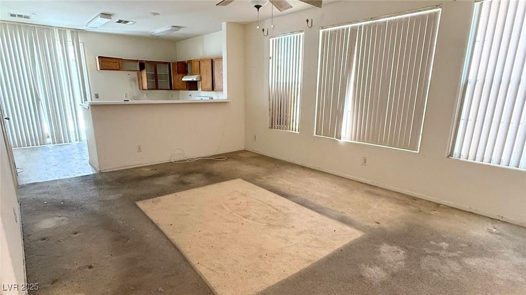 2613 Calico Hearts Ct, Las Vegas, NV 89106 - unfurnished living room featuring ceiling fan and unfinished concrete flooring