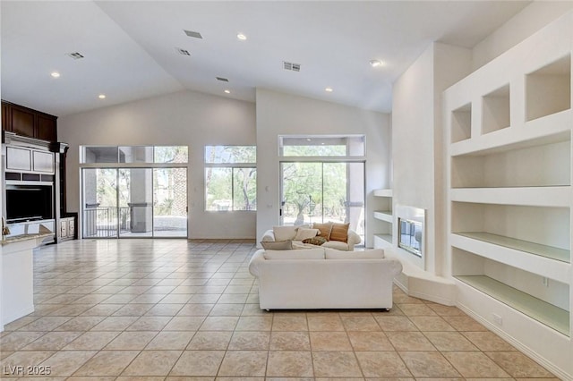 536 Pima Canyon Ct, Las Vegas, NV 89144 - living area with built in features, high vaulted ceiling, light tile patterned flooring, and recessed lighting