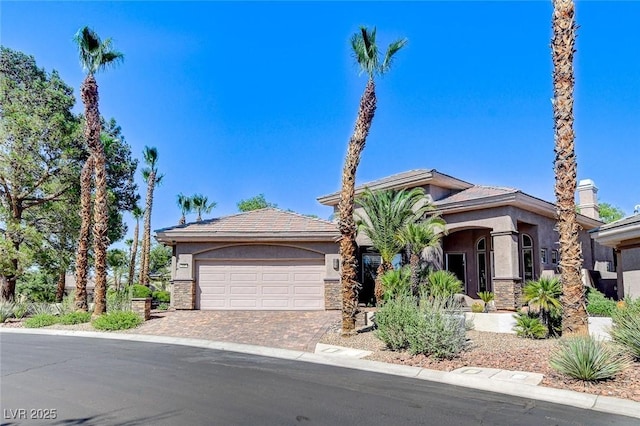 536 Pima Canyon Ct, Las Vegas, NV 89144 - view of front of home featuring stucco siding, an attached garage, and driveway