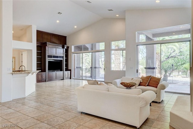 536 Pima Canyon Ct, Las Vegas, NV 89144 - living room featuring high vaulted ceiling, recessed lighting, and light tile patterned floors