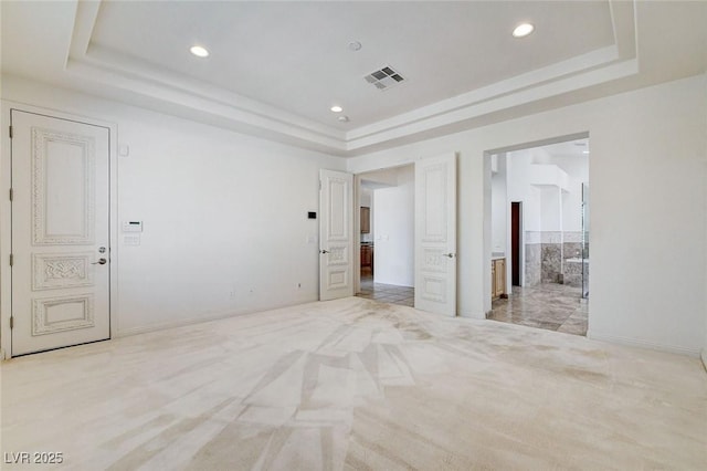 536 Pima Canyon Ct, Las Vegas, NV 89144 - unfurnished bedroom featuring a raised ceiling, recessed lighting, connected bathroom, and light colored carpet