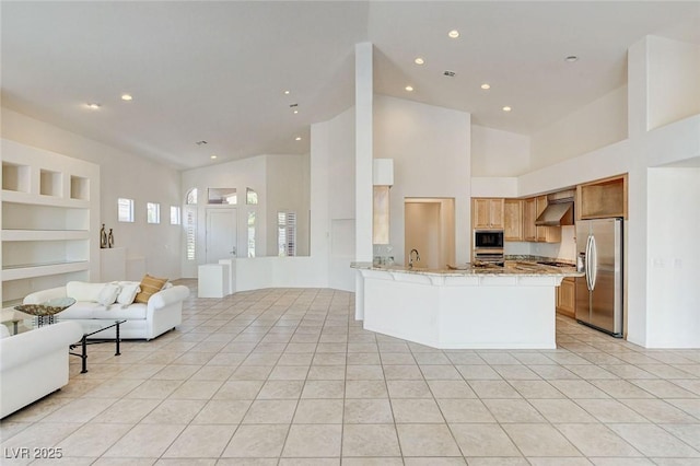 536 Pima Canyon Ct, Las Vegas, NV 89144 - kitchen with appliances with stainless steel finishes, open floor plan, light tile patterned flooring, recessed lighting, and range hood