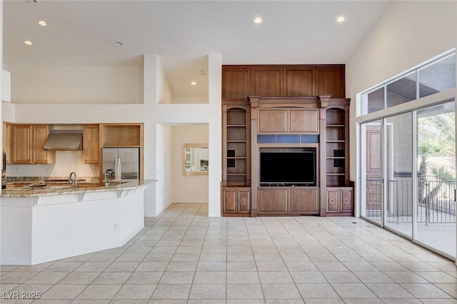 536 Pima Canyon Ct, Las Vegas, NV 89144 - unfurnished living room featuring recessed lighting, light tile patterned floors, and a towering ceiling