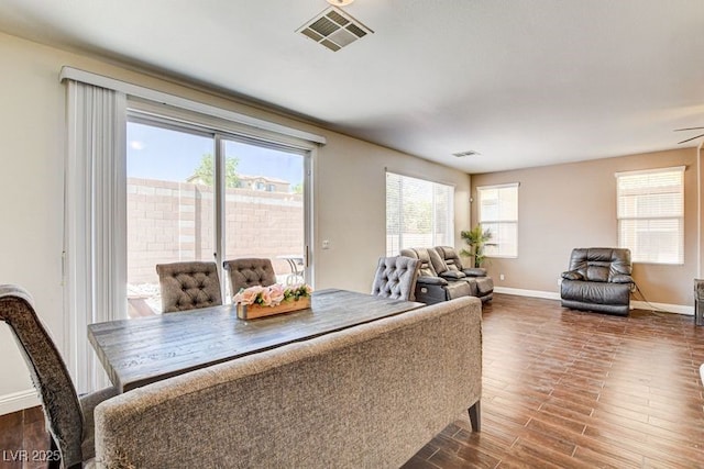 4440 Acropolis Ave, North Las Vegas, NV 89031 - dining room with plenty of natural light and dark wood-style floors