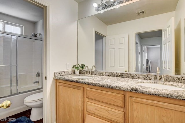 4440 Acropolis Ave, North Las Vegas, NV 89031 - bathroom with double vanity and shower / bath combination with glass door