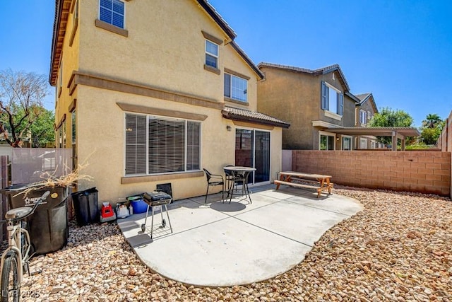 4440 Acropolis Ave, North Las Vegas, NV 89031 - rear view of property featuring stucco siding and a patio area