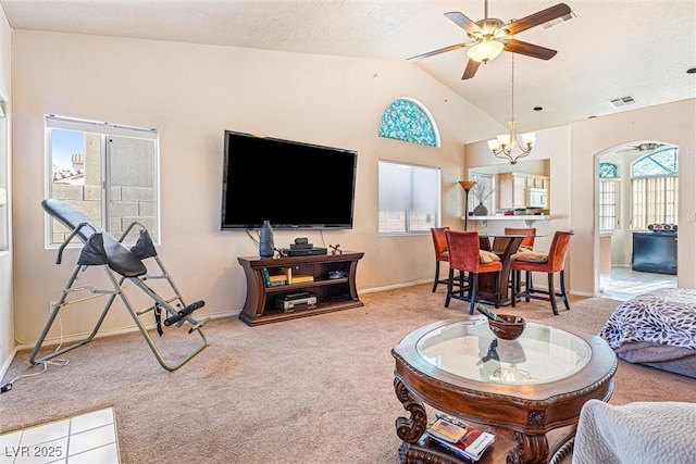 3340 N Campbell Rd, Las Vegas, NV 89129 - carpeted living room featuring plenty of natural light, a ceiling fan, lofted ceiling, and a chandelier