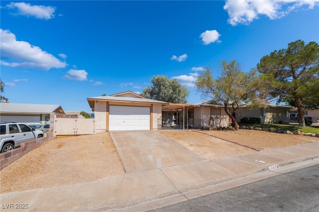 405 Box Elder Way, Henderson, NV 89015 - ranch-style house with stucco siding, an attached garage, a gate, and driveway