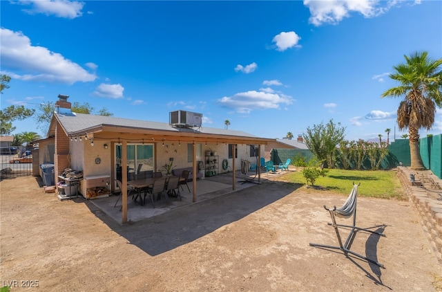405 Box Elder Way, Henderson, NV 89015 - back of house with a fenced backyard, a patio, stucco siding, and a chimney