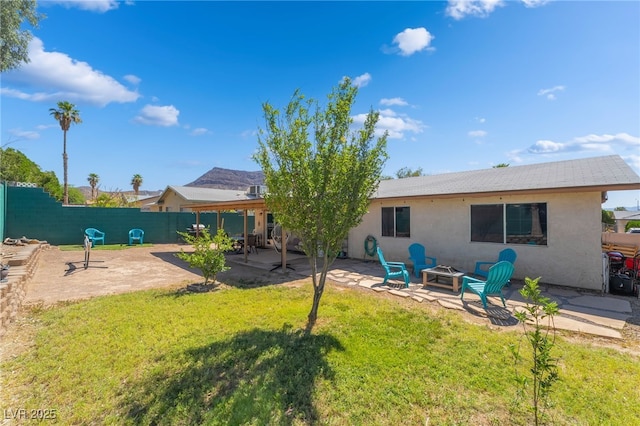 405 Box Elder Way, Henderson, NV 89015 - back of house featuring a fire pit, a patio, a fenced backyard, and stucco siding