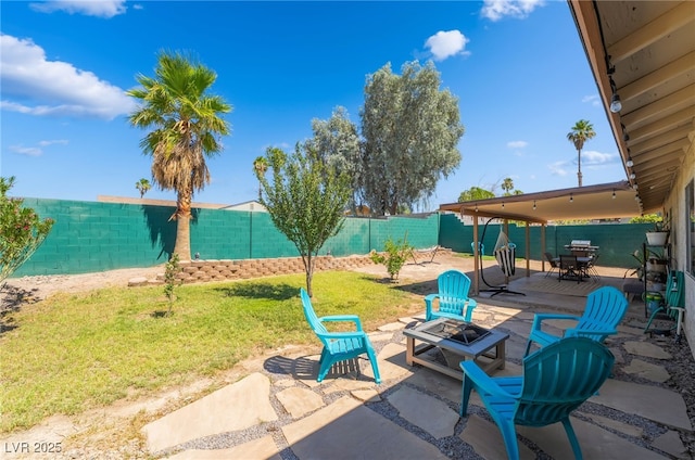 405 Box Elder Way, Henderson, NV 89015 - fenced backyard with an outdoor fire pit and a patio area