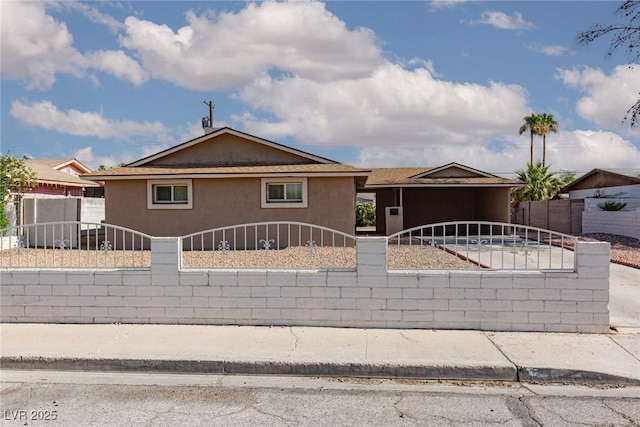 922 Westminster Ave, Las Vegas, NV 89119 - view of front of property with a fenced front yard, concrete driveway, and stucco siding
