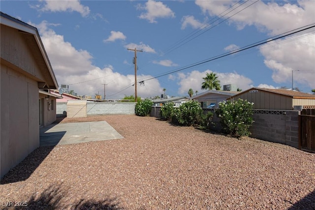 922 Westminster Ave, Las Vegas, NV 89119 - fenced backyard with a patio area
