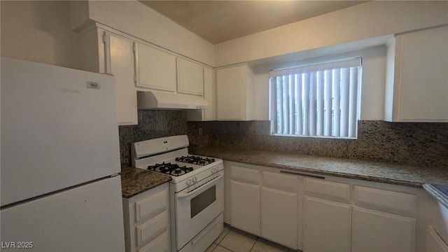 922 Westminster Ave, Las Vegas, NV 89119 - kitchen featuring white appliances, under cabinet range hood, white cabinetry, and tasteful backsplash