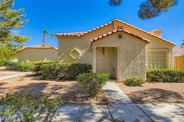 5425 Comchec Way Unit 103, Las Vegas, NV 89108 - mediterranean / spanish-style house with stucco siding and a tile roof