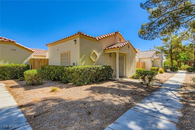 5425 Comchec Way Unit 103, Las Vegas, NV 89108 - mediterranean / spanish-style home with a tile roof and stucco siding