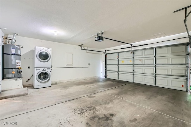 5425 Comchec Way Unit 103, Las Vegas, NV 89108 - garage with estacked washer and dryer, secured water heater, and a garage door opener