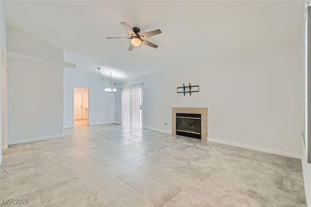 5425 Comchec Way Unit 103, Las Vegas, NV 89108 - unfurnished living room with a ceiling fan, a chandelier, a tiled fireplace, light tile patterned floors, and lofted ceiling