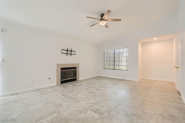 5425 Comchec Way Unit 103, Las Vegas, NV 89108 - unfurnished living room featuring ceiling fan, a tile fireplace, vaulted ceiling, and light tile patterned floors