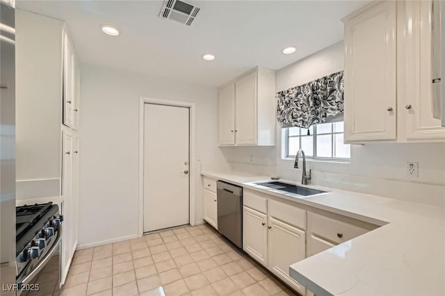 5425 Comchec Way Unit 103, Las Vegas, NV 89108 - kitchen featuring stainless steel dishwasher, gas range oven, light countertops, white cabinets, and recessed lighting