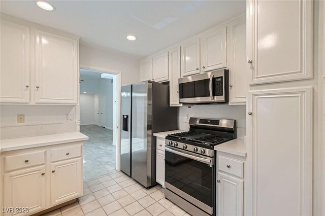 5425 Comchec Way Unit 103, Las Vegas, NV 89108 - kitchen with appliances with stainless steel finishes, white cabinetry, light countertops, and recessed lighting