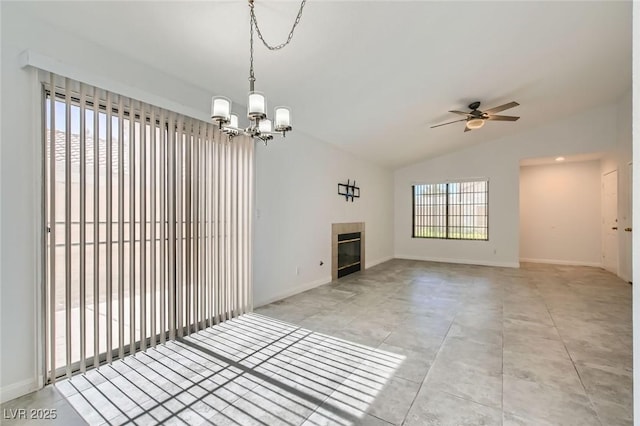 5425 Comchec Way Unit 103, Las Vegas, NV 89108 - unfurnished living room featuring lofted ceiling, ceiling fan, a chandelier, a fireplace, and light tile patterned floors