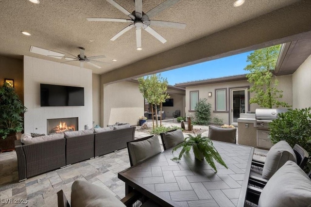 6804 Regency Stone Way, Las Vegas, NV 89148 - view of patio featuring an outdoor living space with a fireplace, ceiling fan, grilling area, and outdoor dining space
