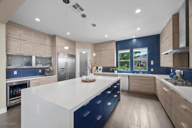 6804 Regency Stone Way, Las Vegas, NV 89148 - kitchen with wine cooler, stainless steel appliances, modern cabinets, light wood-type flooring, and recessed lighting