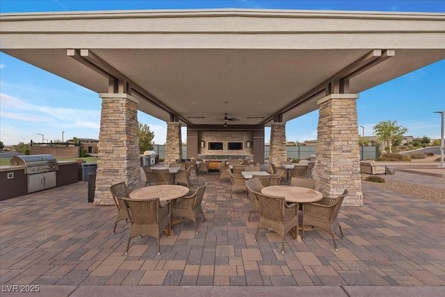 6804 Regency Stone Way, Las Vegas, NV 89148 - view of patio / terrace featuring an outdoor kitchen, outdoor dining space, and ceiling fan