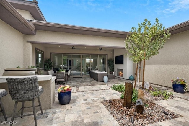 6804 Regency Stone Way, Las Vegas, NV 89148 - view of patio featuring an outdoor living space with a fireplace and ceiling fan