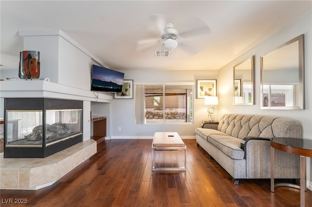 7459 Aurora Glow St, Las Vegas, NV 89139 - living room featuring a ceiling fan, a tile fireplace, and wood-type flooring
