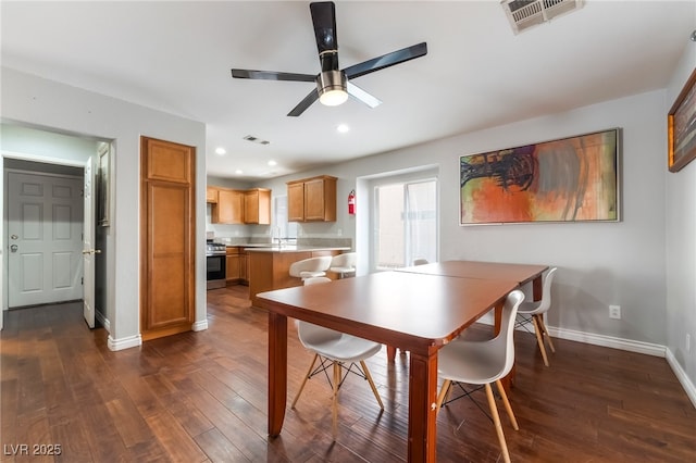 7459 Aurora Glow St, Las Vegas, NV 89139 - dining room featuring a ceiling fan, dark wood finished floors, and recessed lighting
