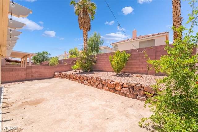 7459 Aurora Glow St, Las Vegas, NV 89139 - fenced backyard with a patio area