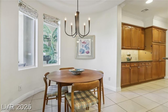 613 Pinnacle Heights Ln, Las Vegas, NV 89144 - dining area featuring a chandelier, light tile patterned floors, and crown molding