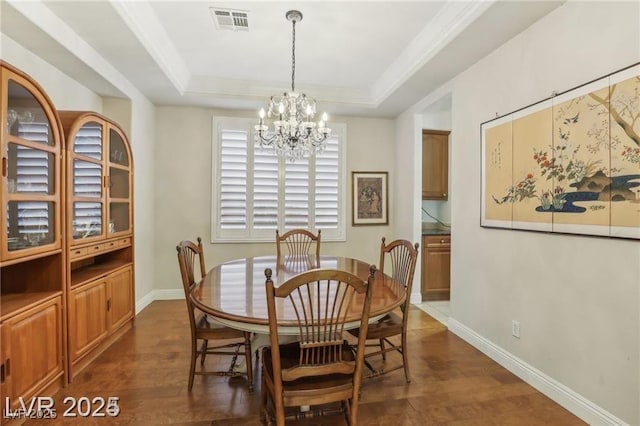 613 Pinnacle Heights Ln, Las Vegas, NV 89144 - dining area featuring a chandelier, dark wood-style flooring, and a tray ceiling