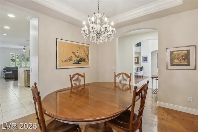 613 Pinnacle Heights Ln, Las Vegas, NV 89144 - dining area with arched walkways, ornamental molding, recessed lighting, ceiling fan, and a chandelier