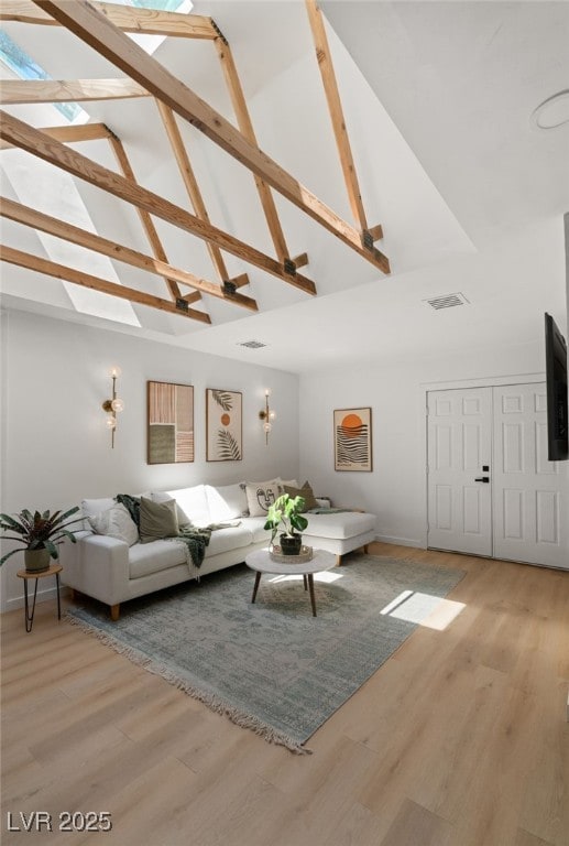 200 Stonewood Ct, Las Vegas, NV 89107 - living room featuring high vaulted ceiling, light wood-type flooring, and beam ceiling