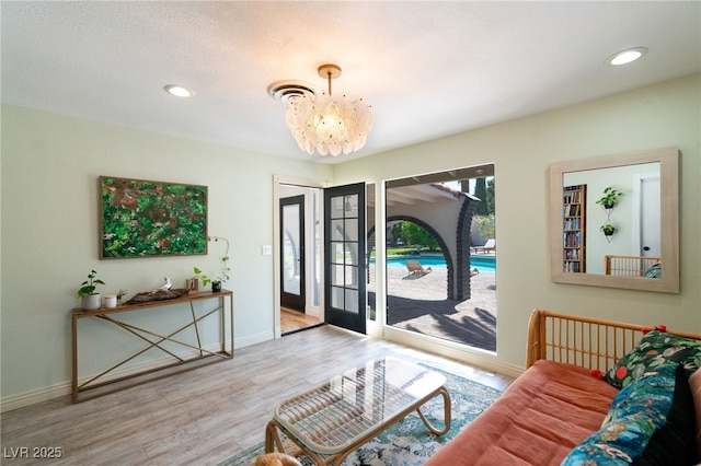 200 Stonewood Ct, Las Vegas, NV 89107 - living area with wood finished floors, a chandelier, and recessed lighting