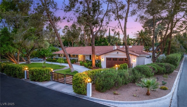 200 Stonewood Ct, Las Vegas, NV 89107 - ranch-style home featuring an attached garage, a yard, stucco siding, and a tile roof