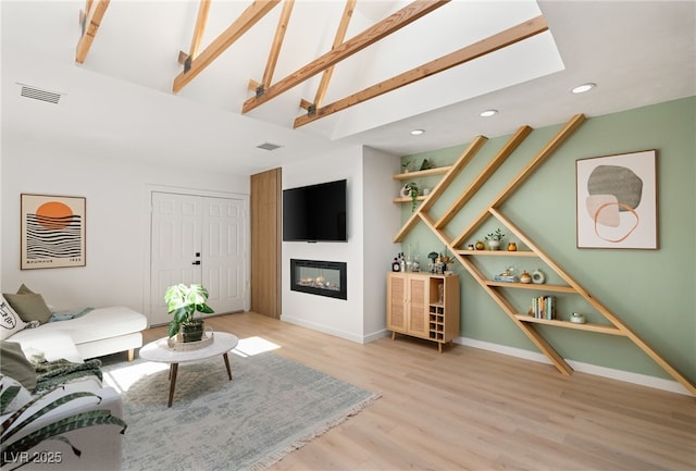 200 Stonewood Ct, Las Vegas, NV 89107 - living room with a glass covered fireplace, light wood-type flooring, recessed lighting, high vaulted ceiling, and beamed ceiling
