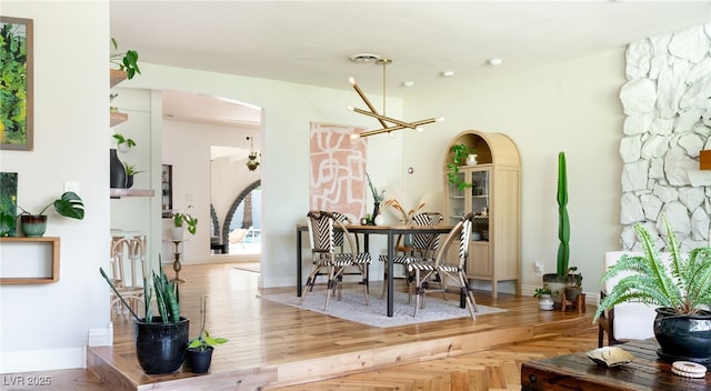 200 Stonewood Ct, Las Vegas, NV 89107 - dining room featuring arched walkways and a chandelier