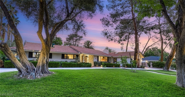 200 Stonewood Ct, Las Vegas, NV 89107 - single story home featuring a lawn, curved driveway, and stucco siding