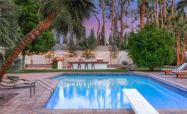 200 Stonewood Ct, Las Vegas, NV 89107 - view of swimming pool with a diving board and a patio area