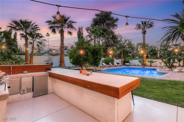200 Stonewood Ct, Las Vegas, NV 89107 - view of pool with an outdoor kitchen, a patio, and a fenced backyard