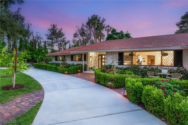200 Stonewood Ct, Las Vegas, NV 89107 - ranch-style home featuring stucco siding, a tile roof, and stone siding