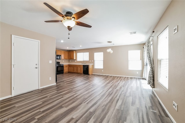 7216 Liberty Pride St, Las Vegas, NV 89148 - unfurnished living room featuring dark wood-type flooring, a ceiling fan, and recessed lighting