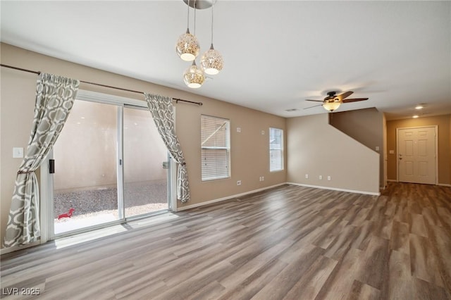 7216 Liberty Pride St, Las Vegas, NV 89148 - unfurnished living room with ceiling fan and wood finished floors